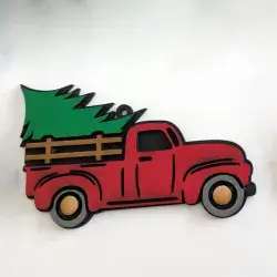 image of a red truck with christmas tree ornament