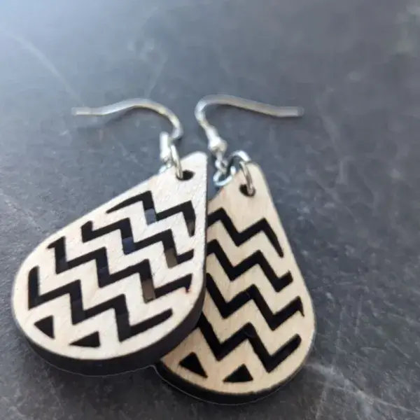 Raindrop shaped earrings cut from birch