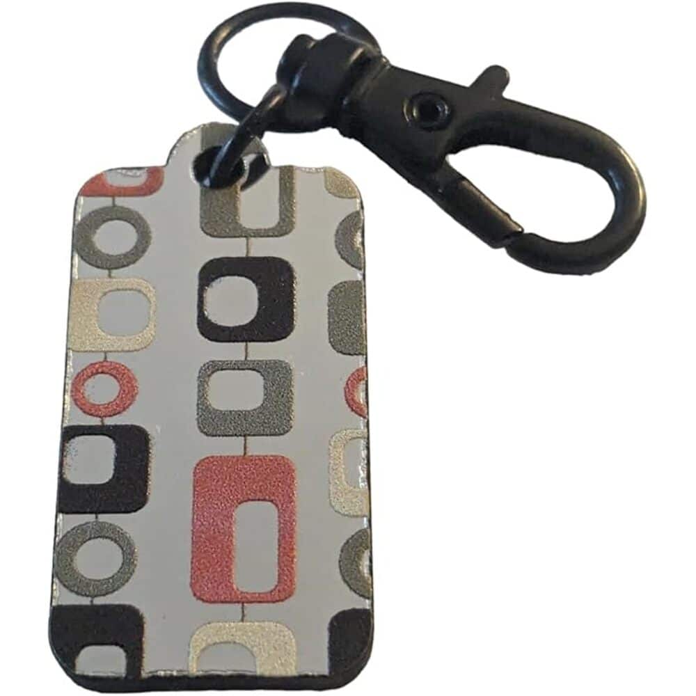 Stylish dog tag with geometric pattern and black clasp, perfect for pet identification and customization.