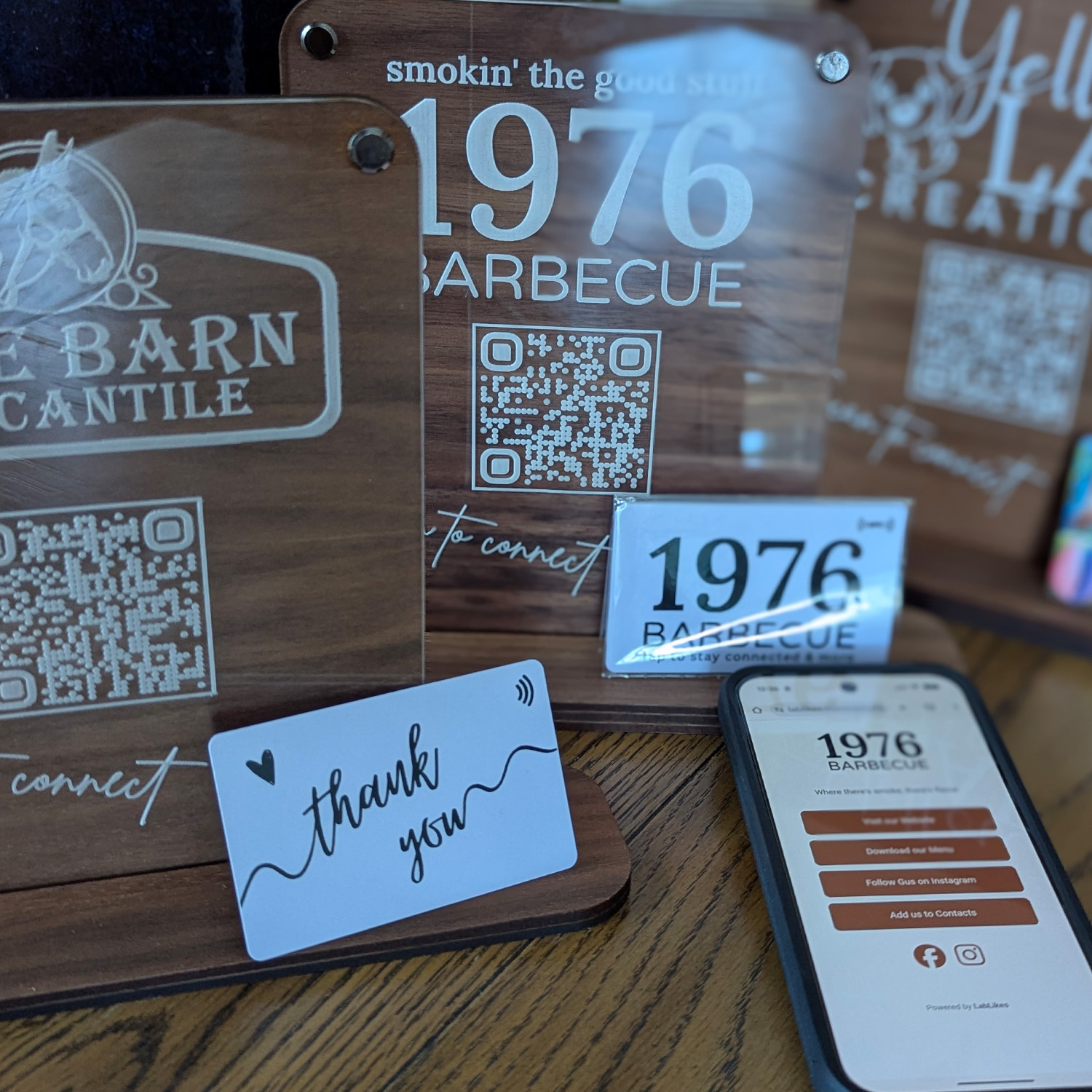 Barbecue restaurant promotional materials with QR codes.