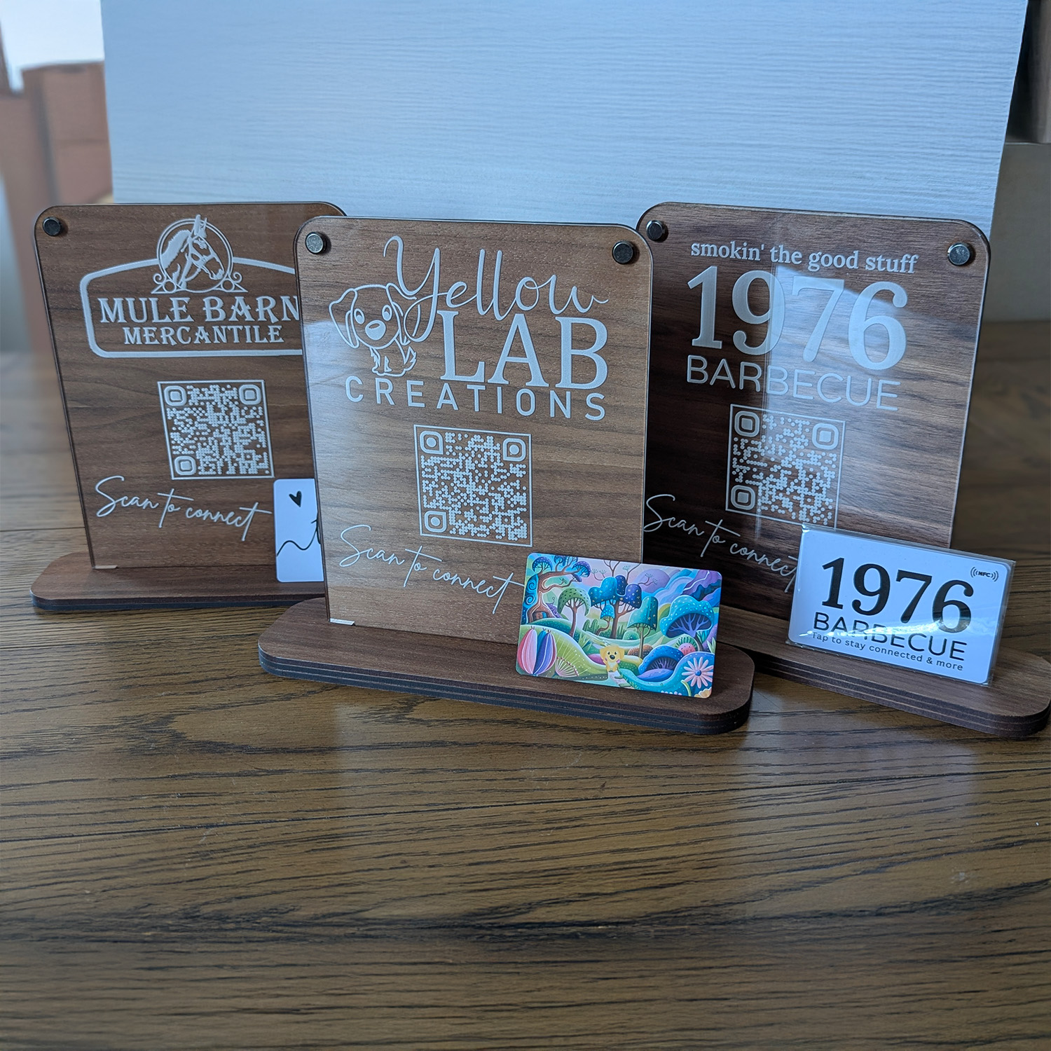 Wooden signs with QR codes for local businesses.